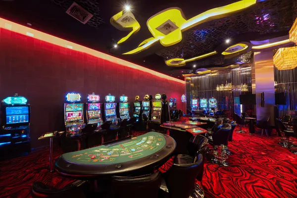 A glamorous woman holding casino chips in a neon-lit environment, representing the premium online casino atmosphere of 0777DET.