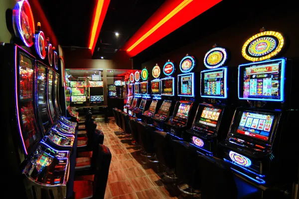 A confident dealer surrounded by casino chips inviting players to access their 0777DET account, reflecting quick and easy login options.